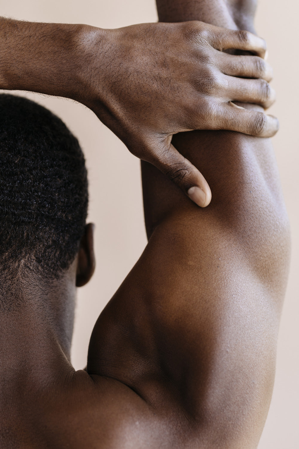 Man stretching his arm.
